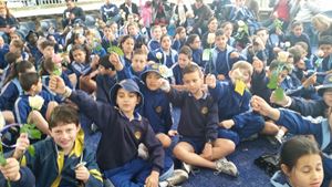 Yr 3 students with their roses for Dad