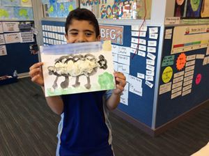 Year 2 student with artwork