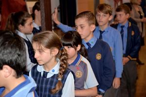 students touching the cross