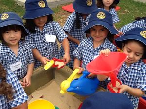 Kindy girls enjoying the sandpit