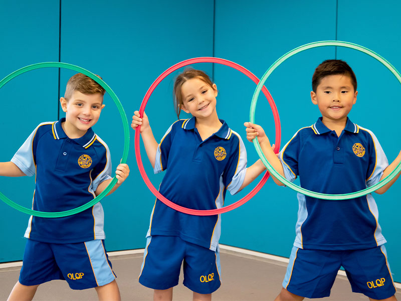 Our Lady Queen of Peace Catholic Primary Greystanes OLQP Three Students with Hula Hoops