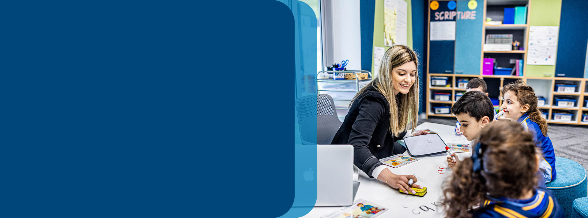 Teacher reading with her students in the classroom at Our Lady Queen of Peace Primary School Greystanes