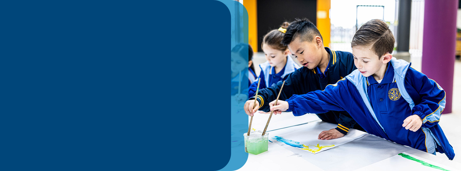 Students painting in the classroom at Our Lady Queen of Peace Primary School Greystanes