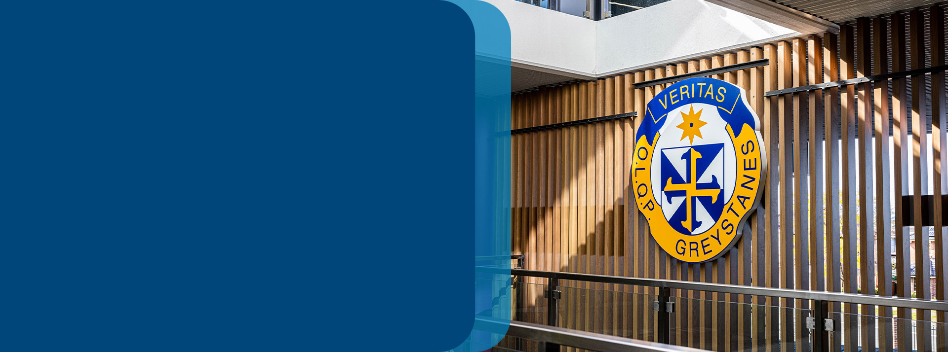 The school crest of Our Lady Queen of Peace Primary School Greystanes