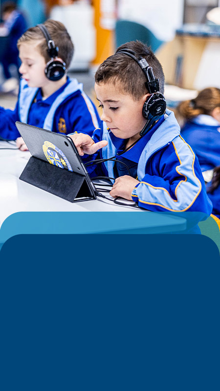 Students using their tablets in the classroom at Our Lady Queen of Peace Primary School Greystanes