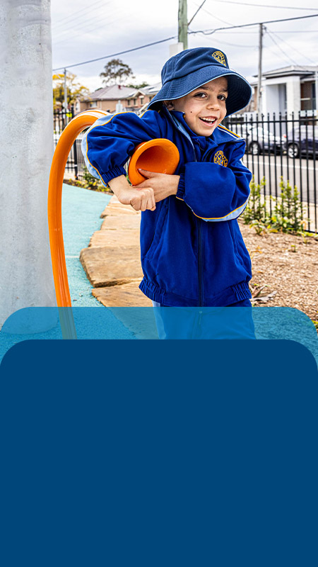 Student playing outside in the playground at Our Lady Queen of Peace Primary School Greystanes