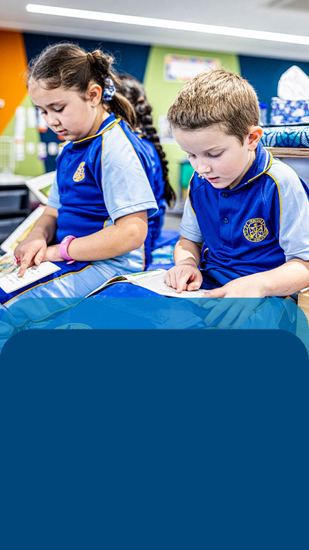 Students reading together in the classroom at Our Lady Queen of Peace Primary School Greystanes
