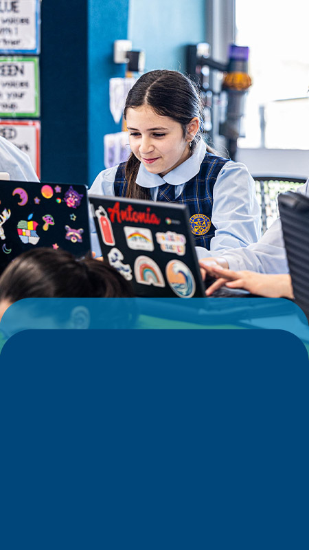 Student working on her laptop in the classroom at Our Lady Queen of Peace Primary School Greystanes
