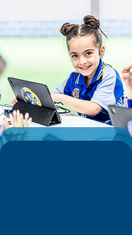 Student using her tablet in the classroom at Our Lady Queen of Peace Primary School Greystanes