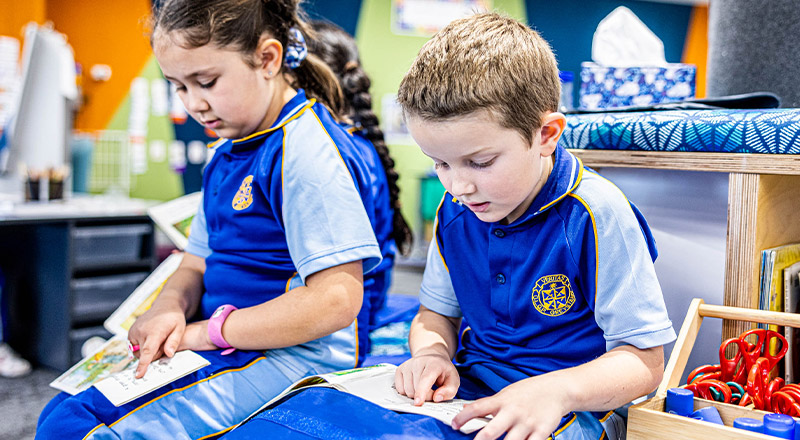 Students reading together in the classroom at Our Lady Queen of Peace Primary School Greystanes