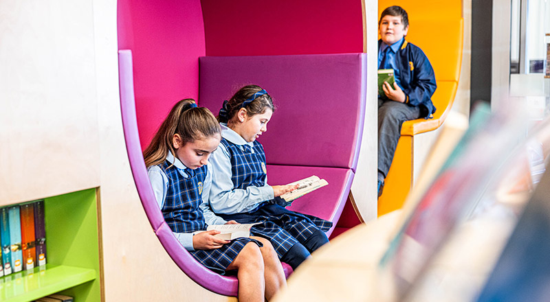 Students reading in the library at Our Lady Queen of Peace Primary School Greystanes