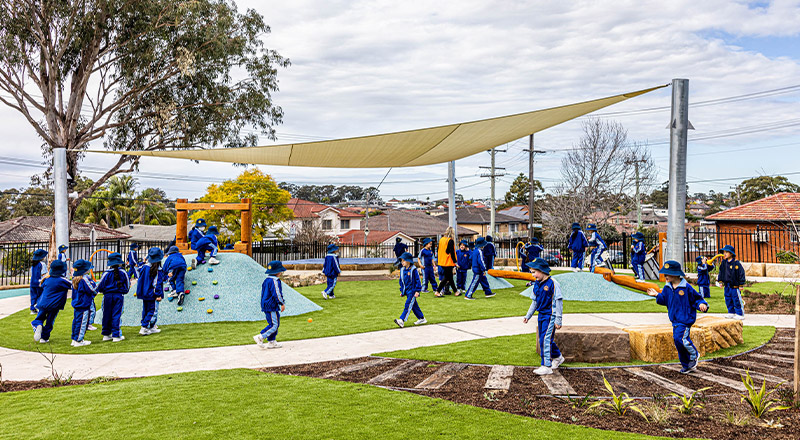 Students playing outside in the playground at Our Lady Queen of Peace Primary School Greystanes