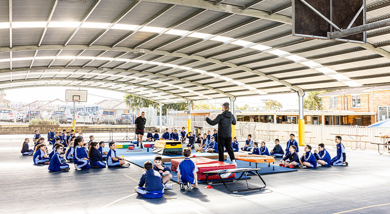 Students on sports day on the multipurpose area at Our Lady Queen of Peace Primary School Greystanes