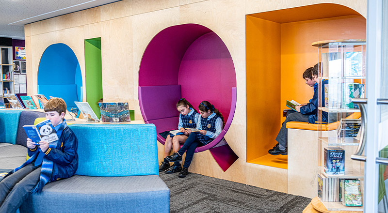 Students reading in the library at Our Lady Queen of Peace Primary School Greystanes