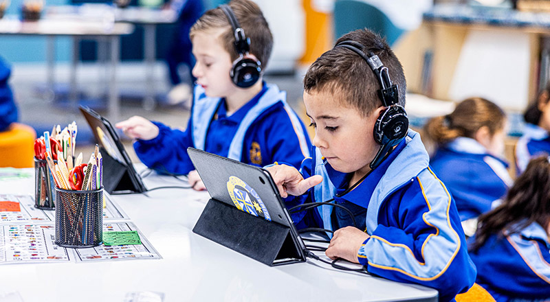 Students using their tablets in the classroom at Our Lady Queen of Peace Primary School Greystanes