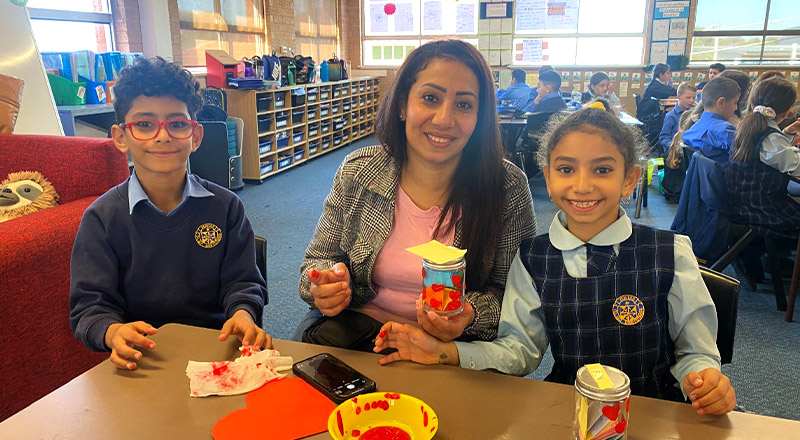 Students with their mother in the classroom at Our Lady Queen of Peace Primary School Greystanes
