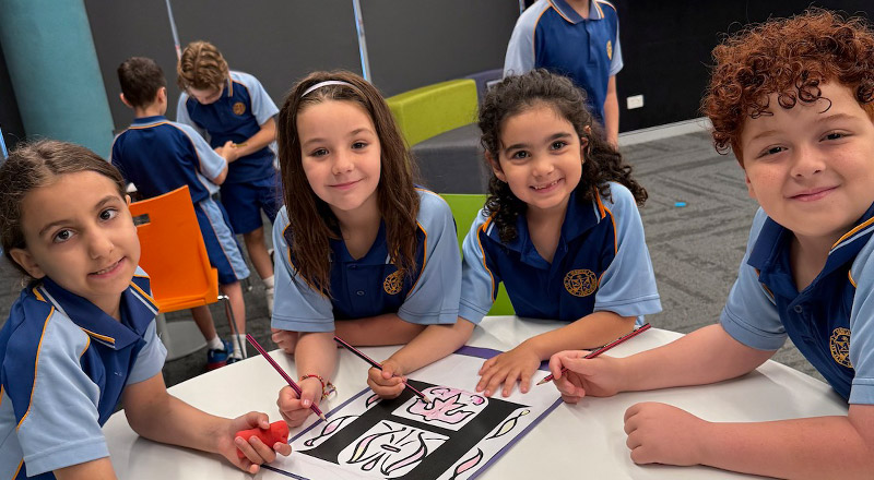 Students working on an activity together in religion class at Our Lady Queen of Peace Primary School Greystanes