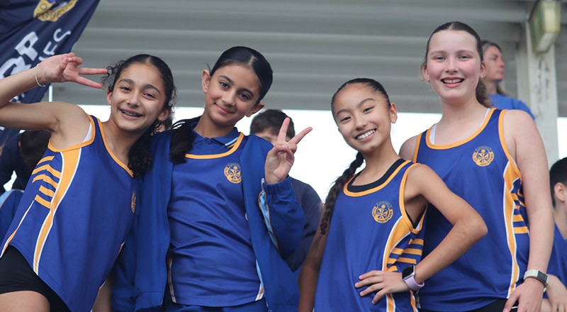 Students representing Our Lady Queen of Peace Primary School Greystanes at a sport event