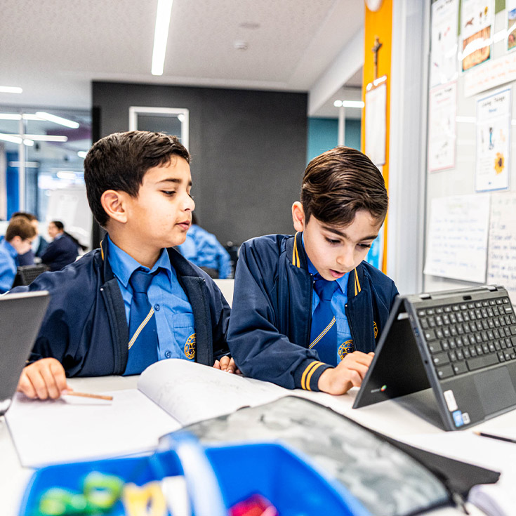 Students learning together in the classroom at Our Lady Queen of Peace Primary School Greystanes